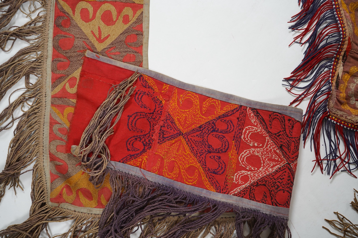 Five various sized late 19th / early 20th century Usbek Saye Gosha (V shaped) Suzani silk embroidered bridal yurt wall hangings, usually forming part of a dowry, two with later fringing, longest 172cm. Condition - some f